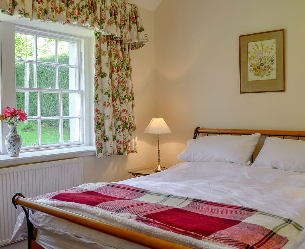 One of the bedrooms at Belses Muir Shepherds Cottage in Ancrum