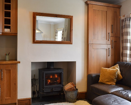 The living room and wood burning stove at Little Bent in Bradnop