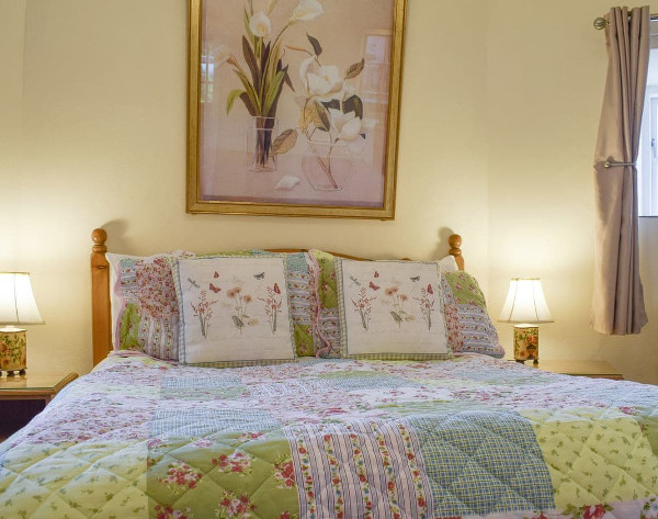 The double bedroom at Mill Stone Cottage at Hunston Mill near Hunston