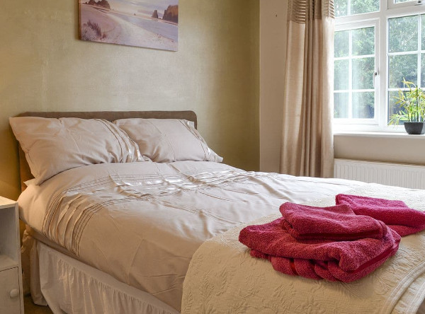 The bedroom at Pinewood Cottage in Hainford, near Norwich